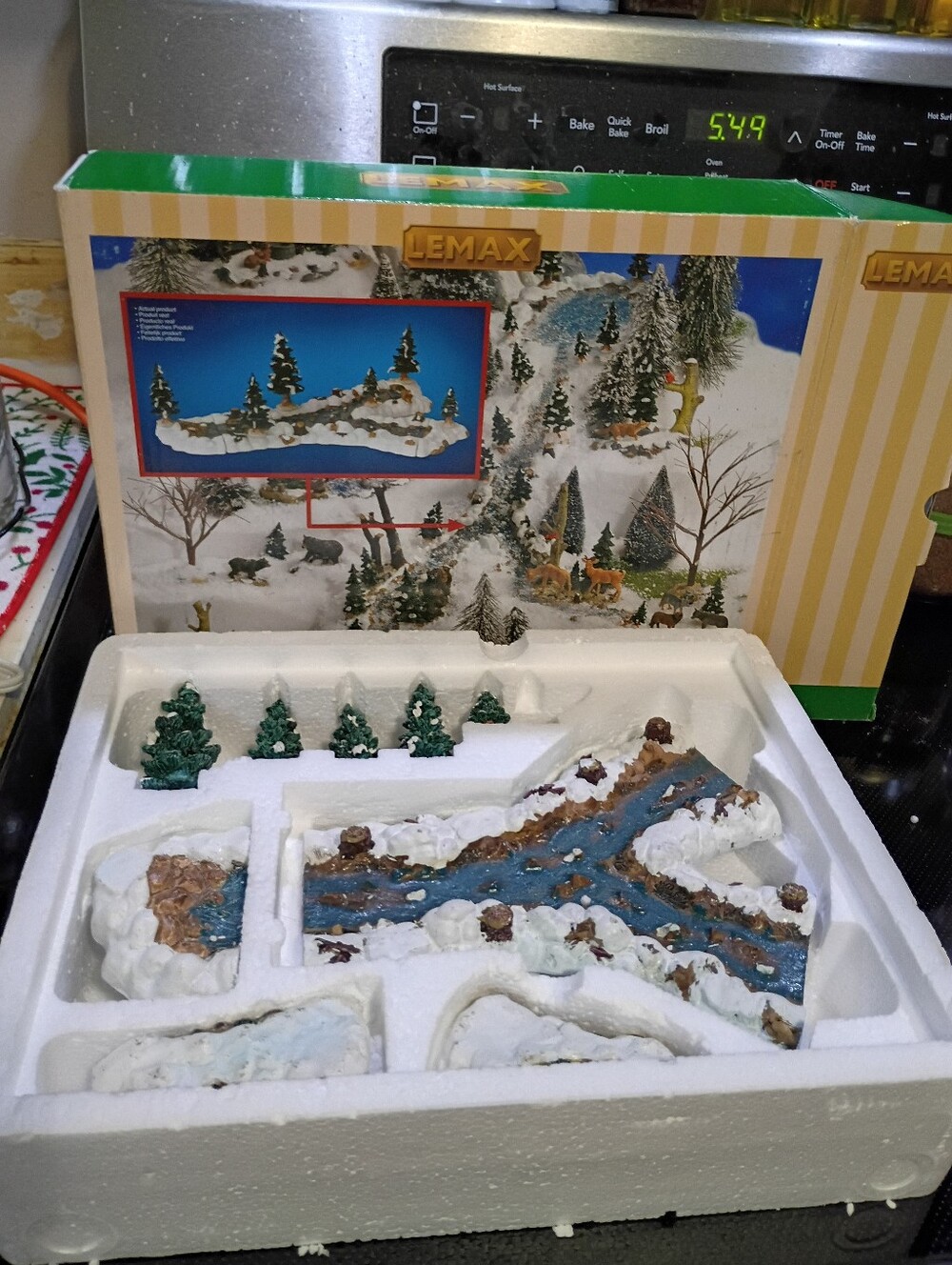 Lemax Blue River Winter Village Accent with Green Trees.